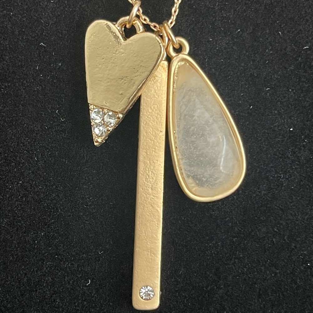 Adjustable gold necklace with charms